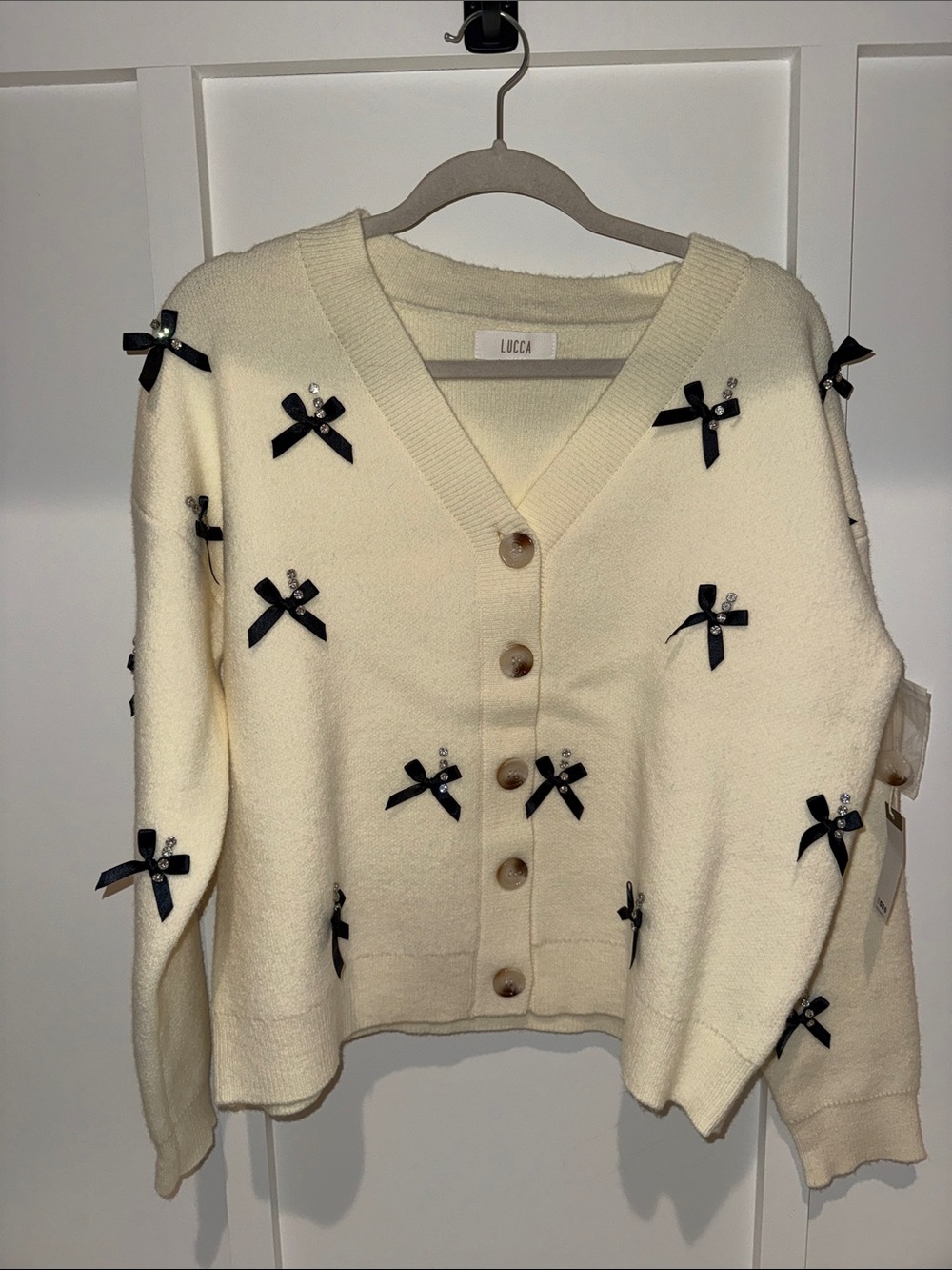 NWT Lucca Cream V-Neck Button Cardigan with Black Bow Accents